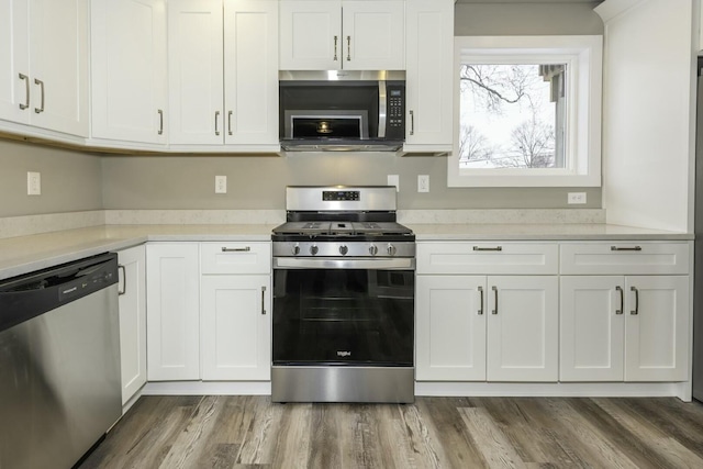 kitchen featuring white cabinetry and stainless steel appliances