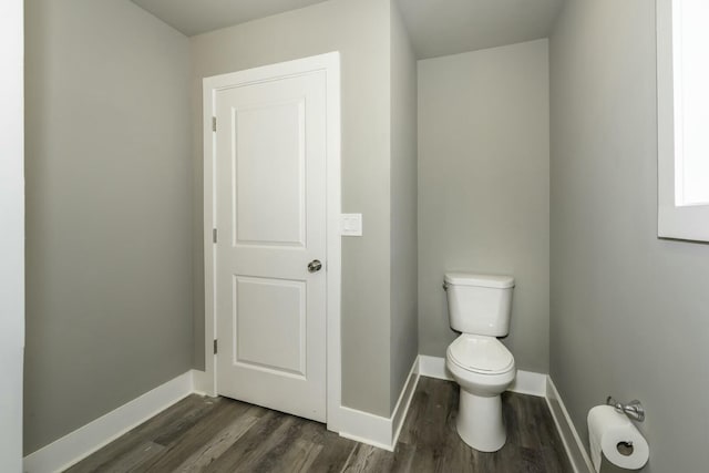 bathroom featuring toilet and hardwood / wood-style flooring