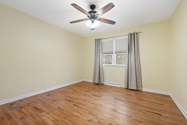 unfurnished room with ceiling fan, a baseboard heating unit, and light hardwood / wood-style flooring