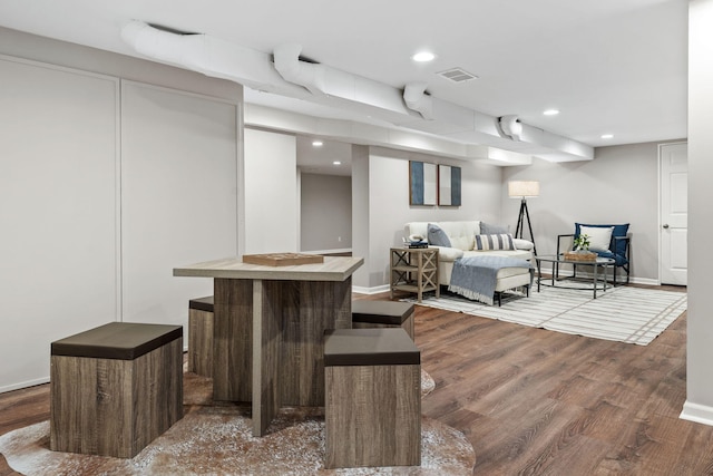 bedroom with hardwood / wood-style floors