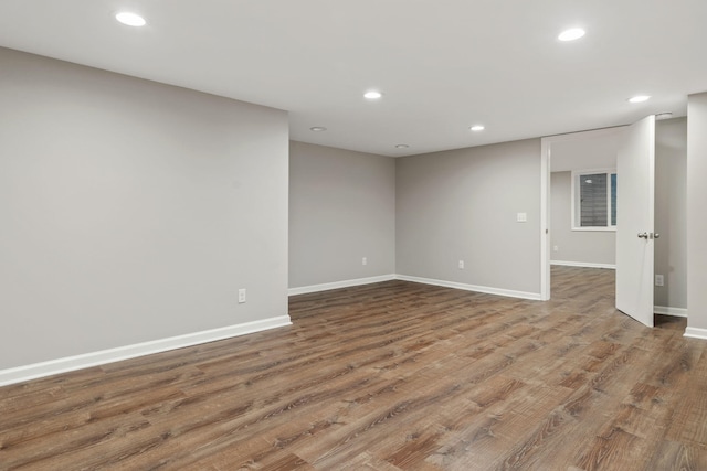 unfurnished room featuring hardwood / wood-style flooring