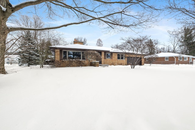 view of snow covered house