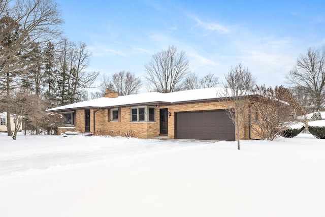 ranch-style home with a garage