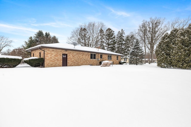 view of snow covered property