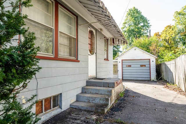 exterior space with an outbuilding and a garage