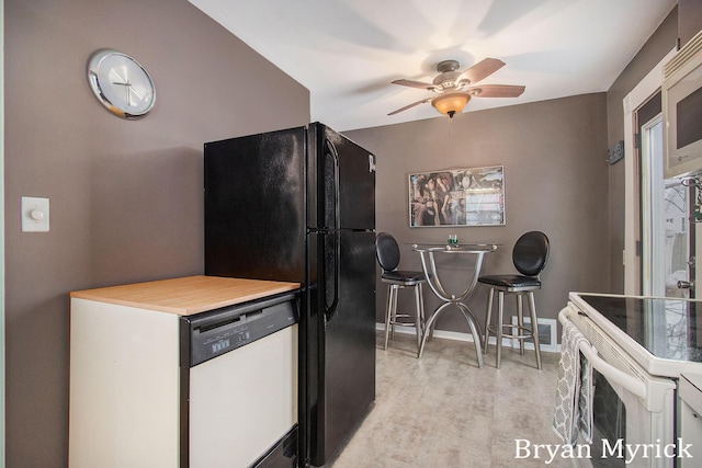 kitchen featuring ceiling fan and white appliances