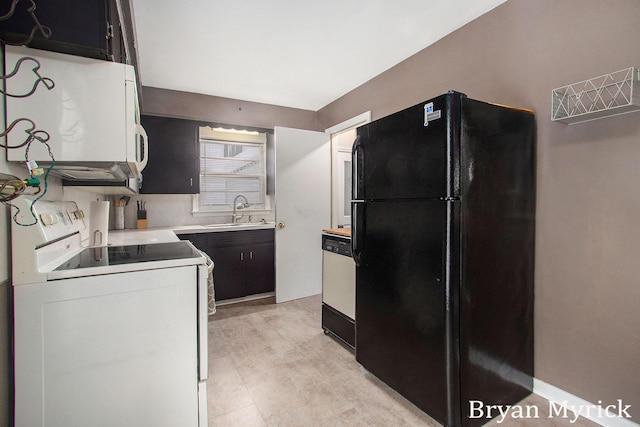 kitchen featuring sink and white appliances