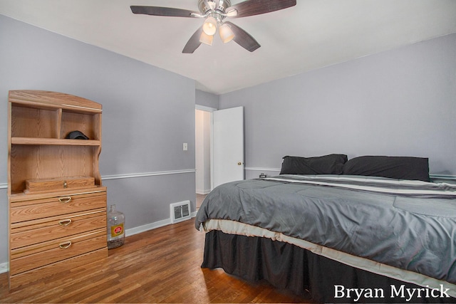 bedroom featuring ceiling fan and dark hardwood / wood-style flooring