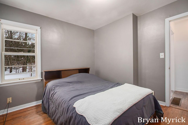 bedroom featuring wood-type flooring