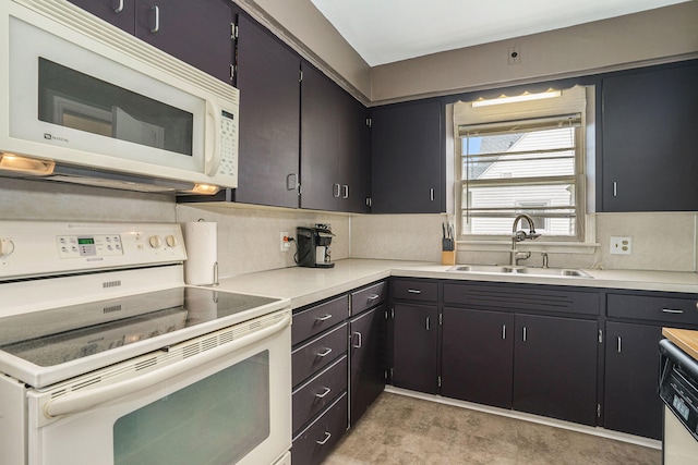 kitchen with decorative backsplash, sink, and white appliances