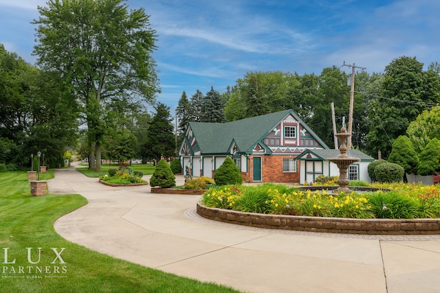 view of property's community with a lawn