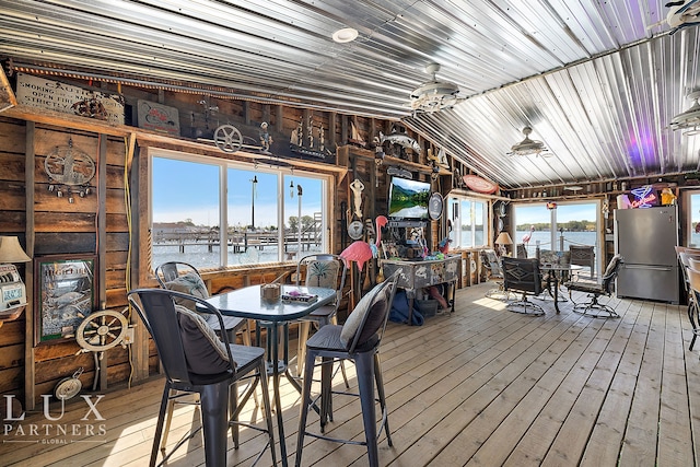 dining space with hardwood / wood-style floors and lofted ceiling