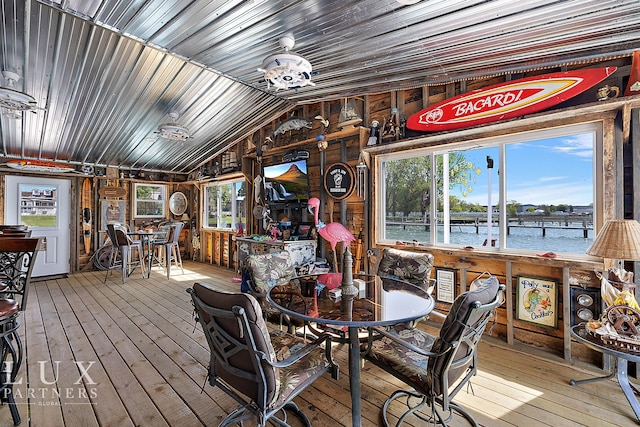 interior space with hardwood / wood-style floors, an inviting chandelier, and lofted ceiling