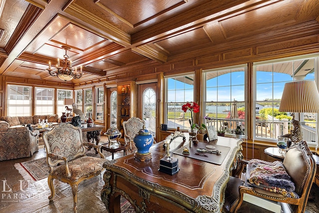 interior space with wood ceiling, an inviting chandelier, a water view, beam ceiling, and coffered ceiling