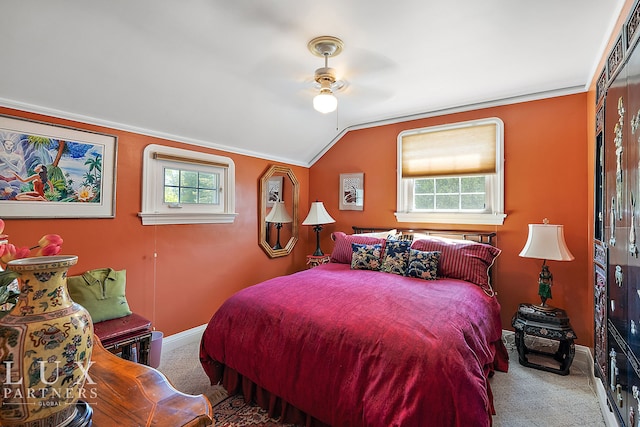 bedroom with ceiling fan, multiple windows, and carpet floors