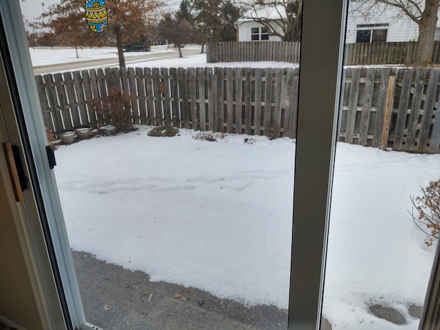 view of yard layered in snow