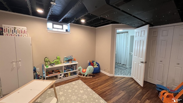 playroom with dark hardwood / wood-style flooring