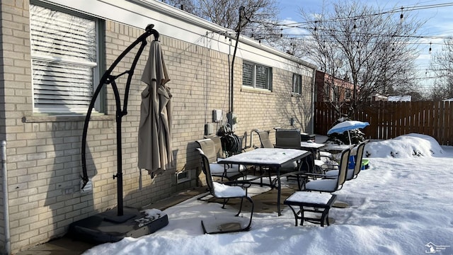 view of snow covered patio