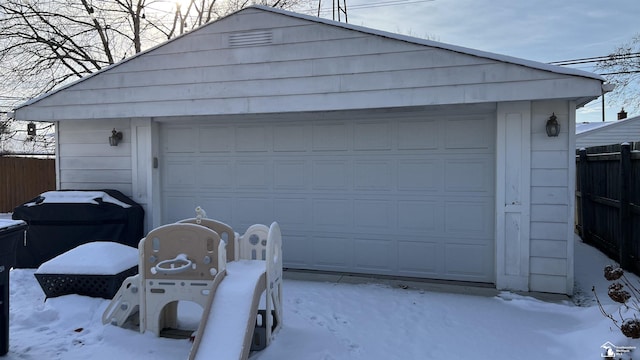 view of snow covered garage