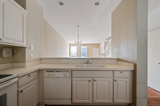 13319 St Ervin Ave Unit 17, Detroit, MI 48215 - kitchen featuring a notable chandelier, light countertops, white cabinetry, a sink, and white appliances