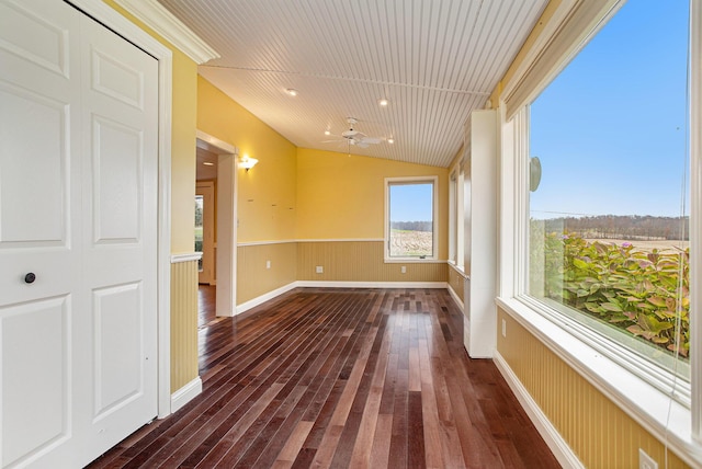 spare room with ceiling fan, lofted ceiling, and dark hardwood / wood-style floors