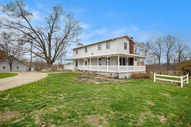 farmhouse-style home with a porch and a front yard