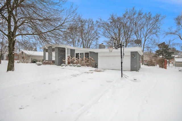 single story home featuring a garage