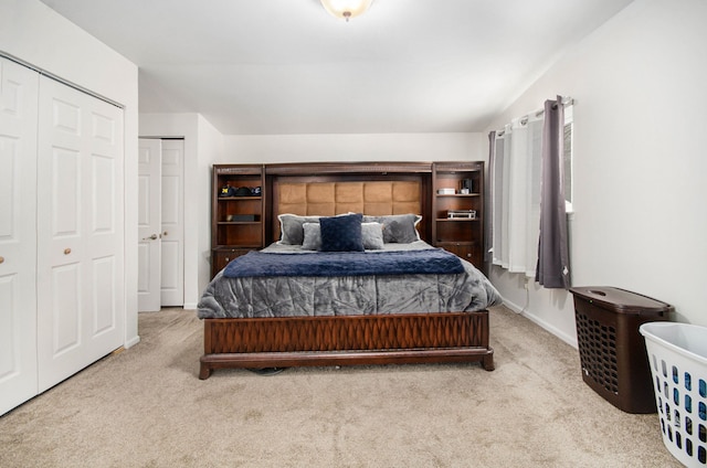 carpeted bedroom with lofted ceiling