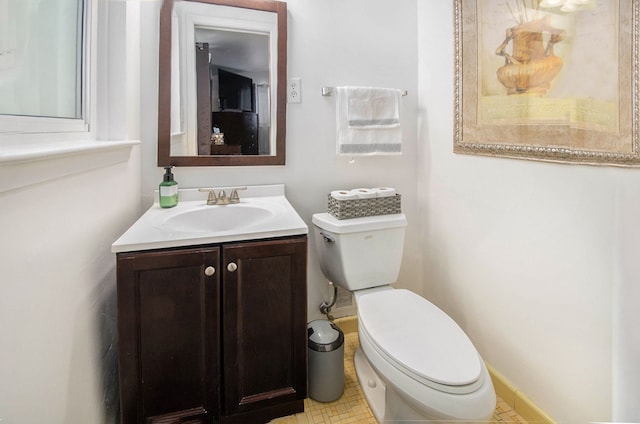 bathroom with toilet and vanity