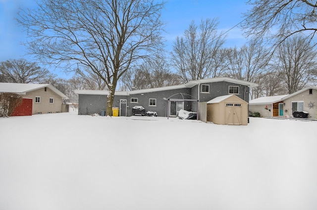 view of front of property with a shed