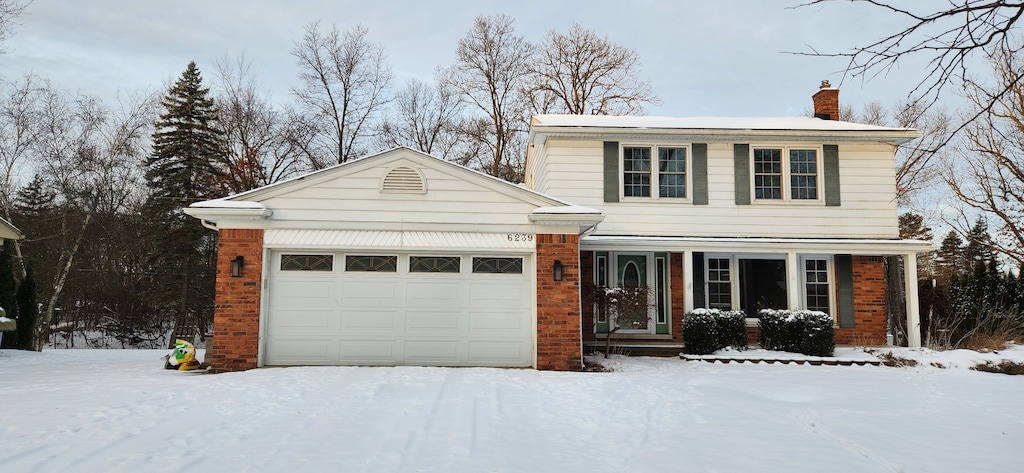 front facade with a garage