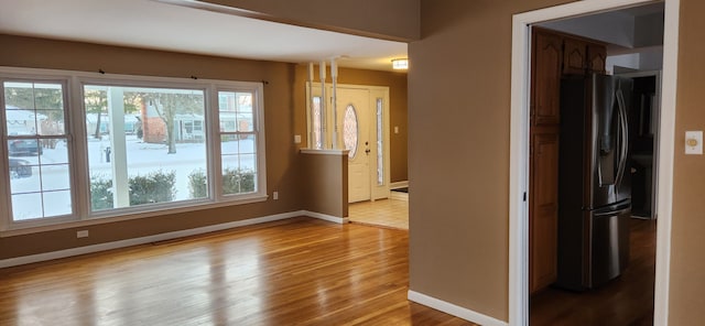 interior space featuring a healthy amount of sunlight and hardwood / wood-style floors