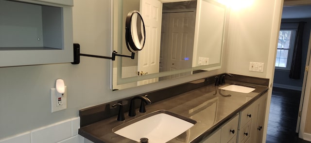 bathroom featuring hardwood / wood-style flooring and vanity