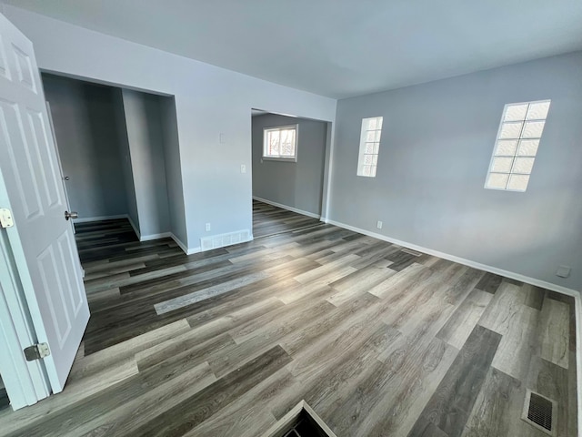 empty room featuring hardwood / wood-style flooring and a wealth of natural light