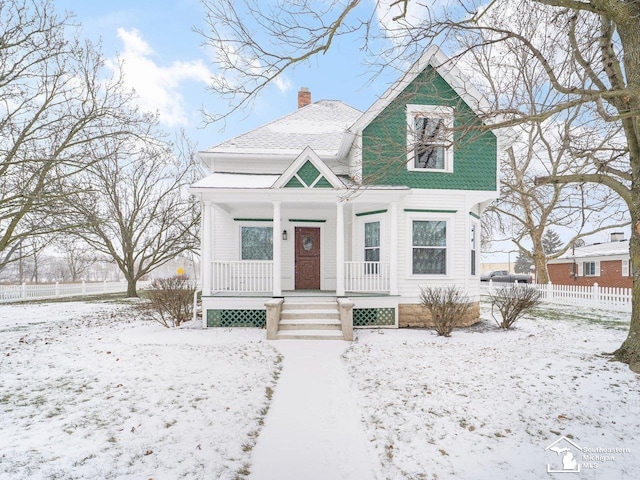 victorian house featuring a porch