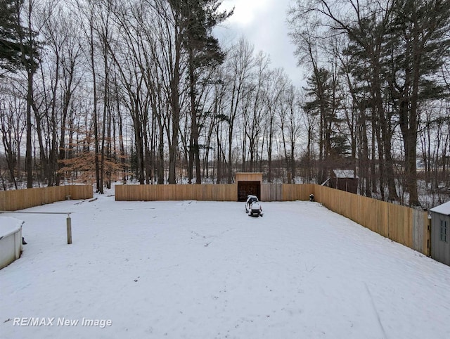 view of yard covered in snow