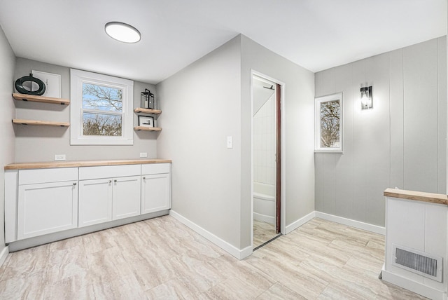 bar with white cabinetry