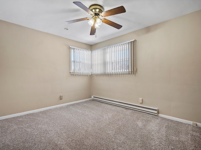 carpeted spare room with ceiling fan and a baseboard radiator