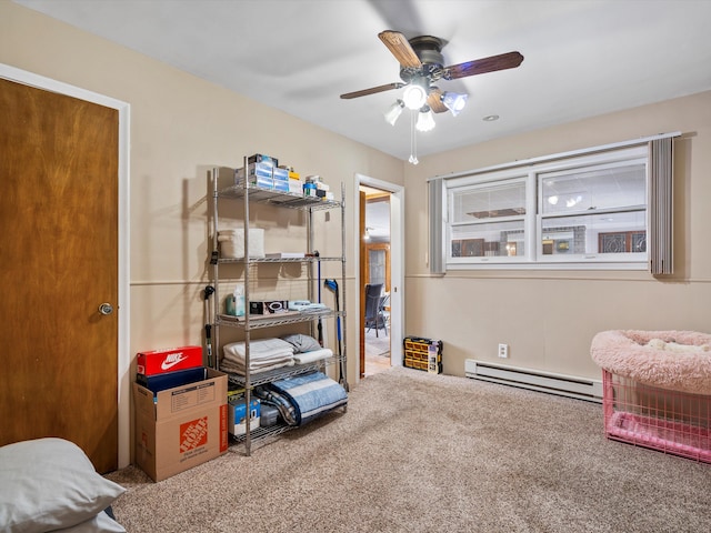 interior space featuring ceiling fan and a baseboard heating unit