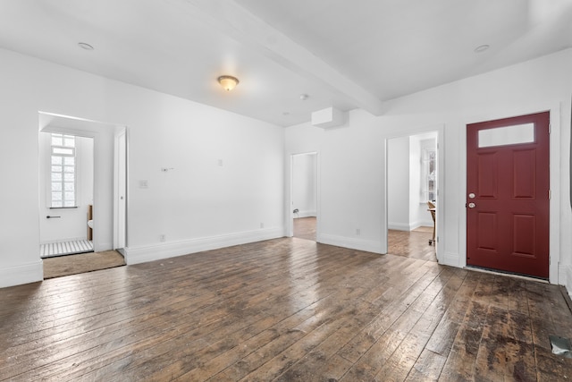 foyer with beam ceiling and dark hardwood / wood-style flooring