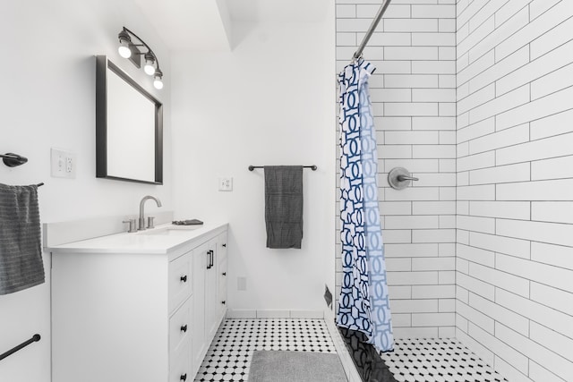 bathroom featuring curtained shower and vanity