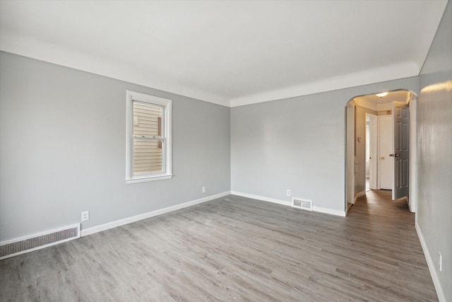 spare room featuring dark hardwood / wood-style floors