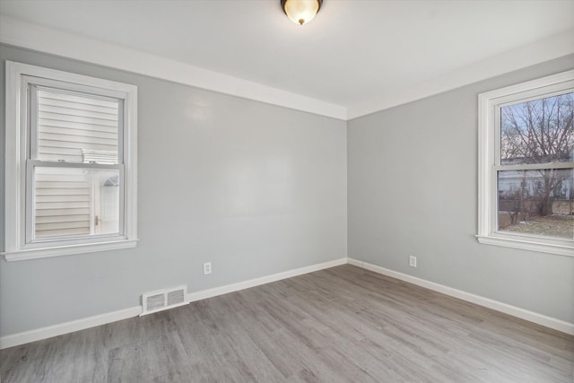 unfurnished room featuring light hardwood / wood-style flooring