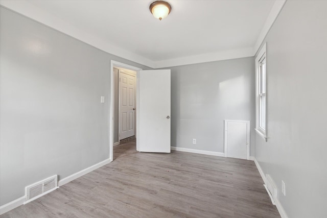 spare room with light hardwood / wood-style floors