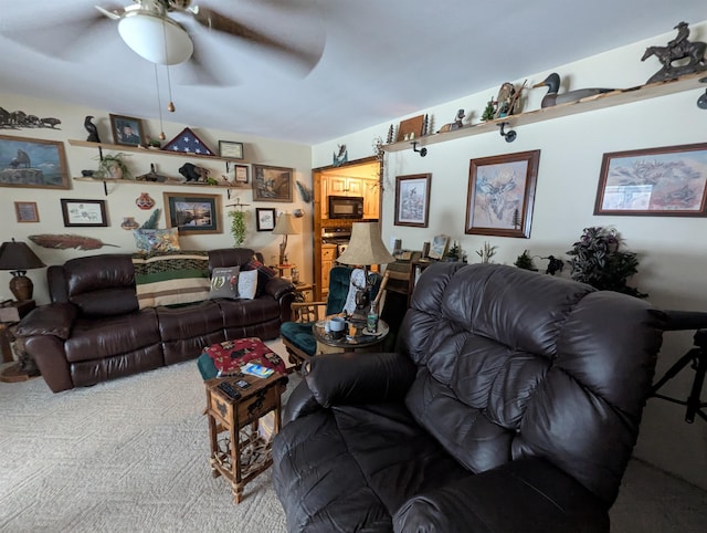 carpeted living room with ceiling fan