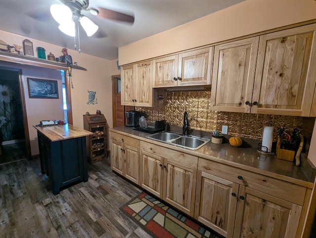 kitchen with ceiling fan, backsplash, wooden counters, sink, and dark wood-type flooring