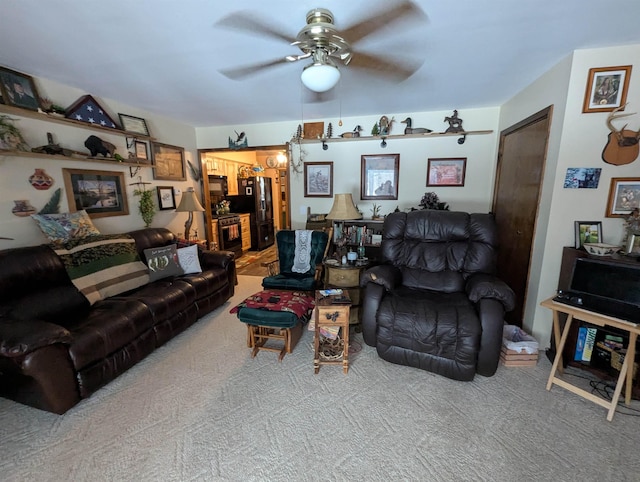 carpeted living room featuring ceiling fan