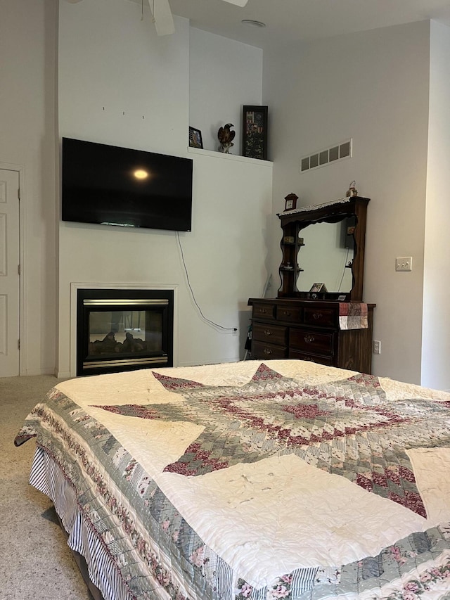 2273 Woodland Trl, Hillsdale, MI 49242 - bedroom with carpet floors and a glass covered fireplace