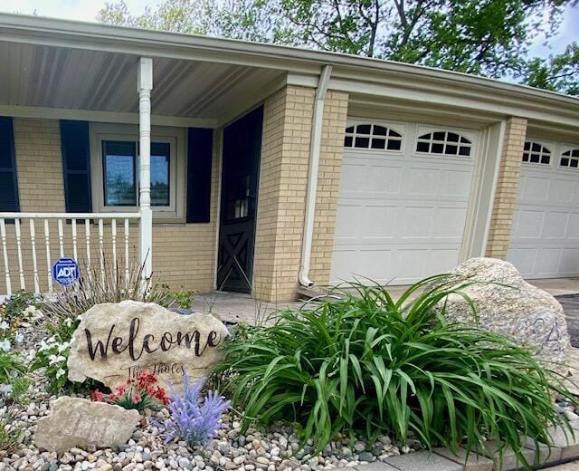 entrance to property featuring a garage