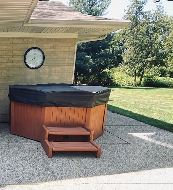 view of patio with a hot tub